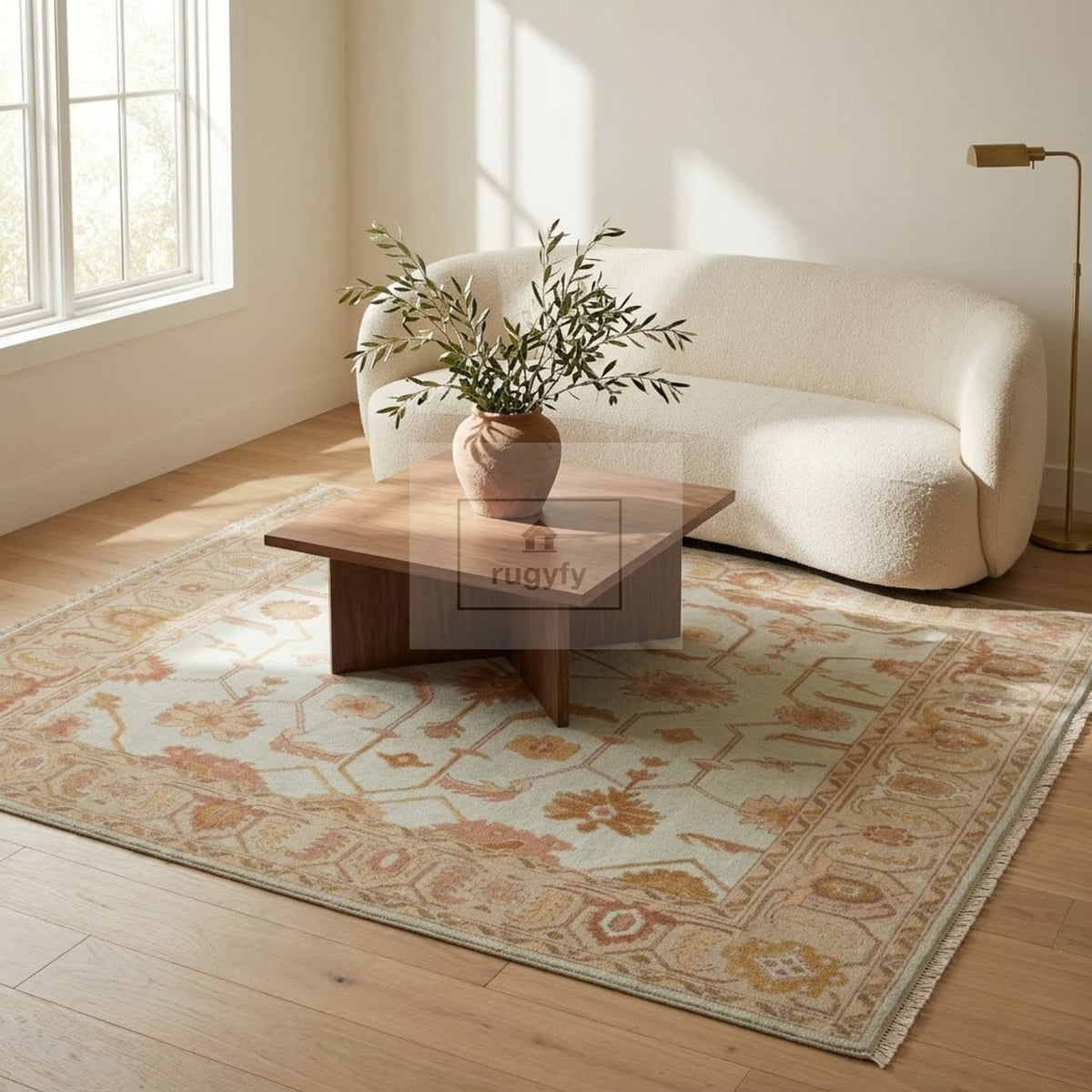 Ivory and honey gold Sultanabad Oushak rug hand-knotted in wool in a bright living room with boucle sofa and walnut coffee table - RUGYFY