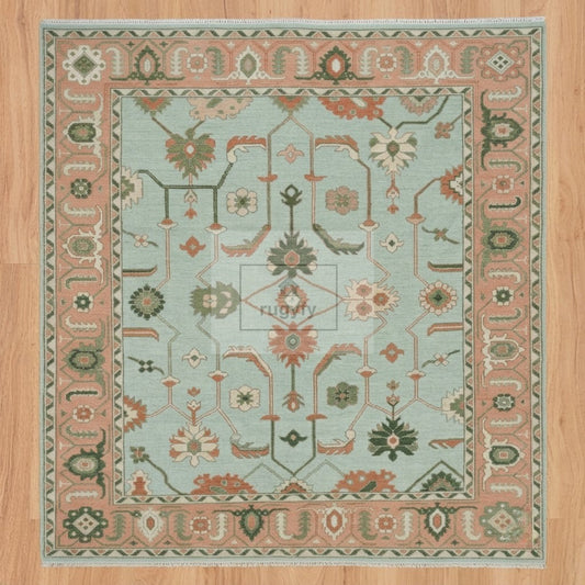 Full view of seafoam aqua and coral peach Sultanabad Oushak rug hand-knotted in New Zealand wool with green palmettes - RUGYFY